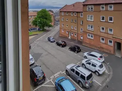 a view of a parking lot with cars parked at Central 1-Bed Apt Sleeps 4 5 mins to Station in Greenock