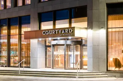 a view of the front of a courant building at Courtyard by Marriott Glasgow SEC in Glasgow