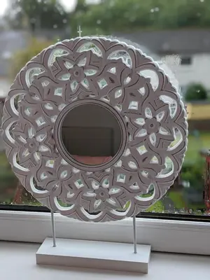 a circular object on display in a window at Glenclova - No 5 Bellyeoman, bright two bedroom apartment in Fife