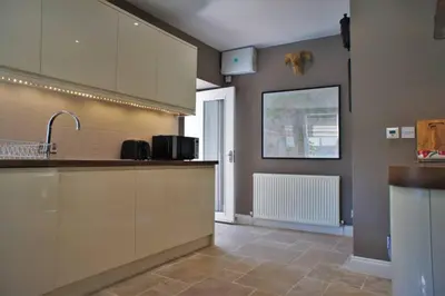 a kitchen with a sink and a counter top at 17 William Street in Helensburgh