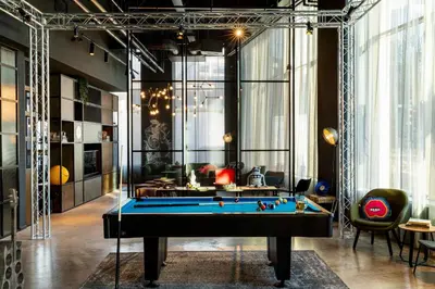 a living room with a pool table in it at Moxy Glasgow SEC in Glasgow