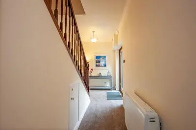 a hallway of a house with a stairway at Island View in Oban