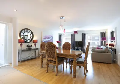 a dining room with a table and chairs at The Shandwick Place Residence No 2 in Edinburgh