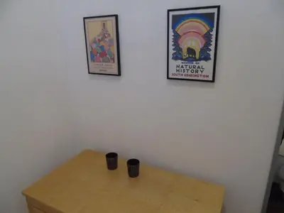 a table with two cups sitting on top of it at Snug - Tearlag Apartment in Helensburgh