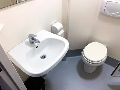 a bathroom with a white sink and a toilet at Glasgow City Centre Studio Apartment in Glasgow