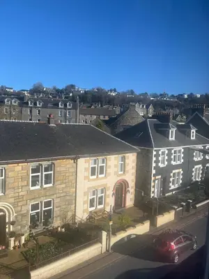a group of houses on a street with a car at DunMoore Guesthouse in Oban