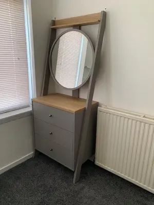 a dressing table with a mirror on top of a dresser at The Cochno Flat, Clydebank in Dalmuir