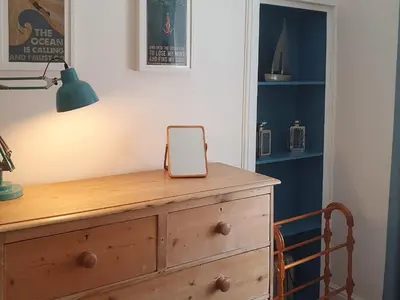 a wooden dresser with a cell phone sitting on top of it at Osocozee in Millport