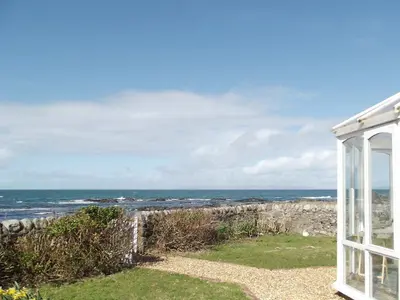 a view of the ocean from a house at Shore Cottage in Bellochantuy