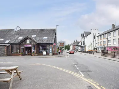 an empty street in a small town with buildings at Forth View-Uk34217 in Aberfoyle