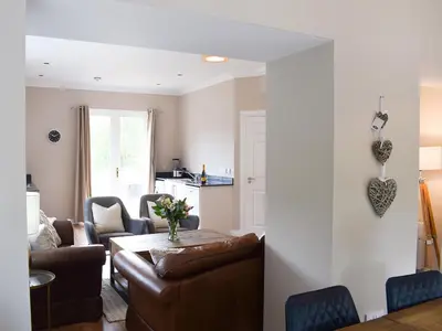a living room with a couch and a table at Forth View-Uk34217 in Aberfoyle