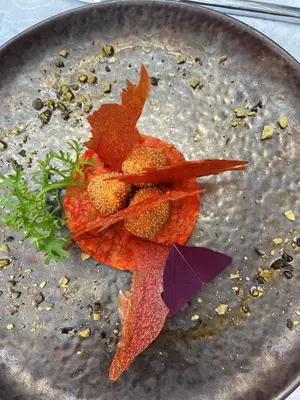a plate of food with autumn leaves on it at Victoria Square & The Orangery in Stirling