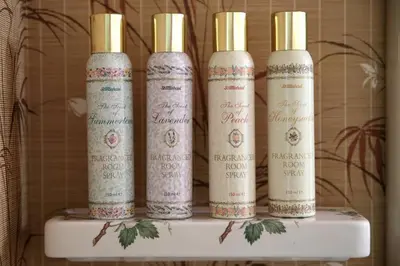 a group of four bottles sitting on top of a shelf at Quirky, West End, Edinburgh House in Edinburgh