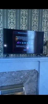a flat screen tv sitting on top of a table at Quirky, West End, Edinburgh House in Edinburgh
