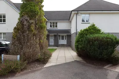 a house with a driveway in front of it at 3 bedroom Windsor Garden apartment by Gleneagles in Blackford