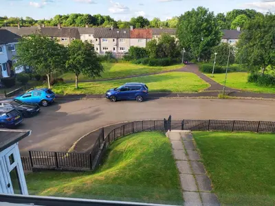 a group of cars parked in a parking lot at Single bedroom in quiet neighbourhood in Mount Vernon