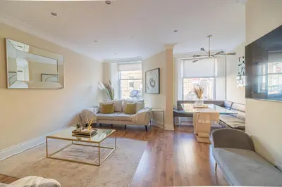a living room with a couch and a table at Large Blythswood Residence in Glasgow