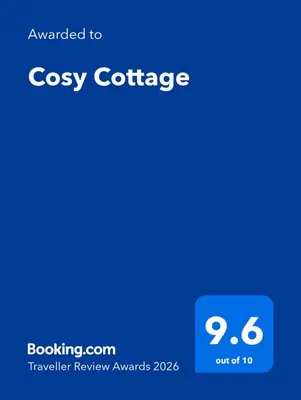 a screenshot of a cell phone with the text overlay upgraded to cozy coffee at Cosy Cottage in Stirling