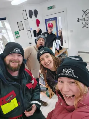 a group of people wearing hats in a hospital room at Coorie Braw Cottage in Kirn