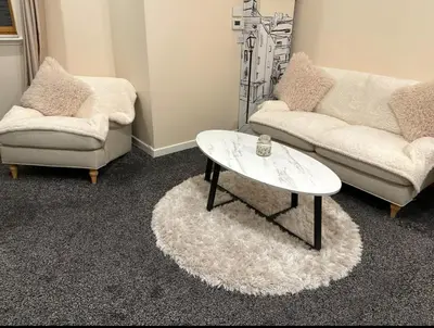 a living room with two couches and a coffee table at Central Glasgow Apt - Sleeps 2 & FreeParking During Weekend in Glasgow