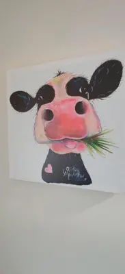 a painting of a cow with grass in its mouth at The Cobbler Cottage - Loch Lomond and Arrochar Alps in Arrochar
