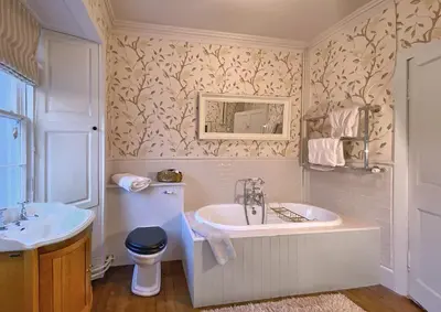 a bathroom with a sink and a tub and a toilet at Park of Drumquhassle in Glasgow