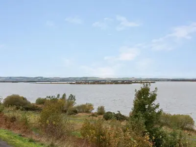 a view of a large body of water at Chalet Loch Leven Lodge 12 by Interhome in Kinross