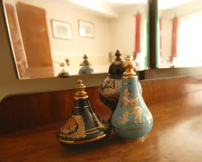 three vases sitting on top of a wooden table at Bonawe House Holiday Cottages in Taynuilt
