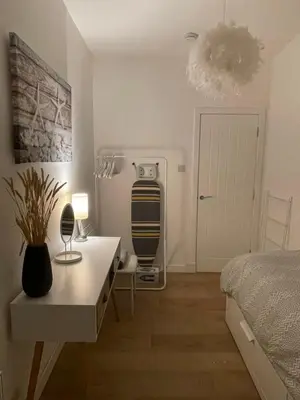 a bedroom with a bed and a desk and a bed at Dunoon River Clyde Flat in Innellan