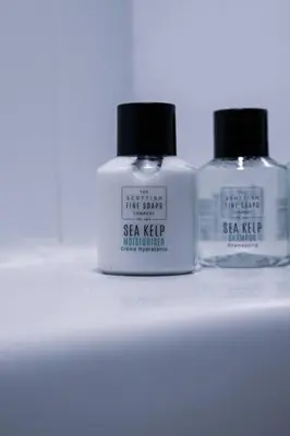 two bottles of soap sitting on a shelf at West End Escape - Prime Location in Glasgow