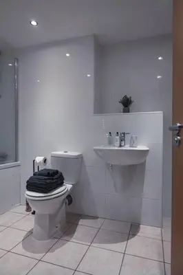 a bathroom with a toilet and a sink at West End Escape - Prime Location in Glasgow