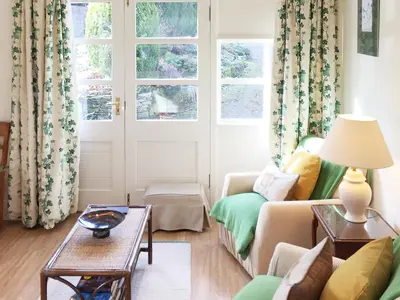 a living room with a couch and a table at The Wee House in Muthill