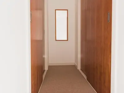 a hallway with a door and a mirror on the wall at Lovely 2-Bed Flat Glasgow Harbour FREE parking - Pass the Keys in Glasgow