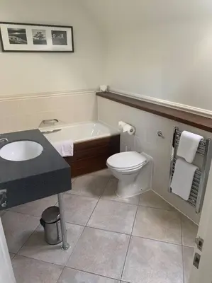 a bathroom with a tub and a toilet and a sink at Ryder Cup Lodge Duchally - Free access to Leisure Club Swimming Pool Hot Tub Steam Room - Starlink Satellite Internet - Sky Glass Now DOG FRIENDLY for 2025 in Auchterarder