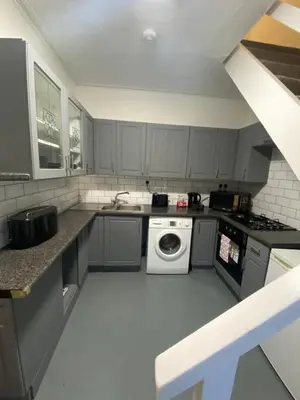 a kitchen with a washing machine and a sink at Glenashdale 28 A 1/R Boyd Street Largs KA308LE in Largs