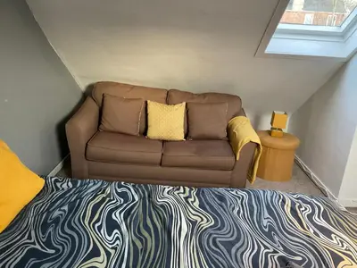 a living room with a couch and a bed at Glenashdale 28 A 1/R Boyd Street Largs KA308LE in Largs