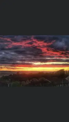 a view of a sunset with clouds in the sky at Glenashdale 28 A 1/R Boyd Street Largs KA308LE in Largs
