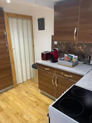 a kitchen with a stove and a counter top at The Mews with Private Parking in Oban