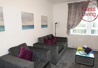 a living room with two couches and a table at Welsh Drive Apartment by Klass Living Blantyre in High Blantyre