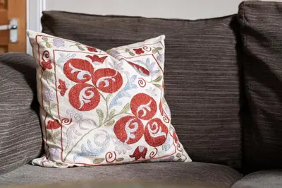 a pillow sitting on top of a couch at amazing apartments - Torphichen Place by Haymarket in Edinburgh