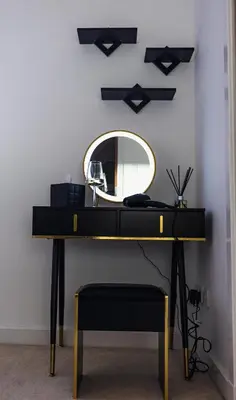 a dressing table with a mirror on a wall at The Skyline Suite - *Private Balcony* *Views* in Glasgow