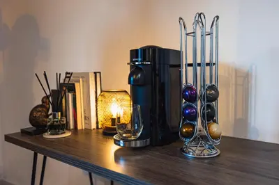 a table with a coffee maker and glasses on it at The Skyline Suite - *Private Balcony* *Views* in Glasgow