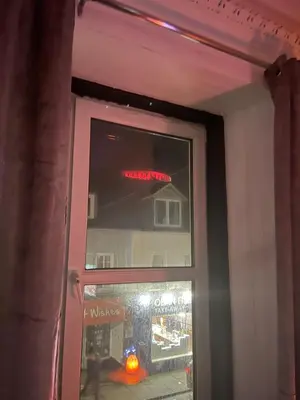 a glass door with a sign on top of it at Heart of George street / Oban / Argyll in Oban