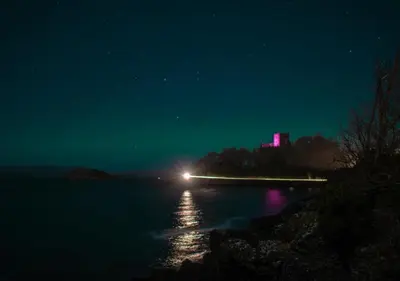 a light on the water at night at Heart of George street / Oban / Argyll in Oban