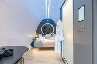 a bedroom with a bed in a room with a window at The Secret Hideaway in Penicuik