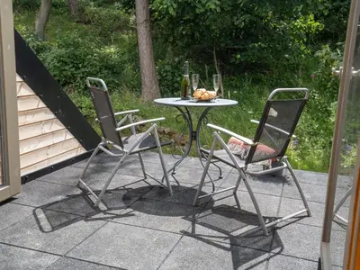 two chairs and a table on a patio at Alban in Linlithgow