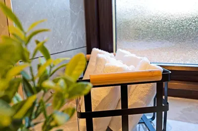 a towel rack with a bunch of towels on it at Pitcorthie House in Dunfermline