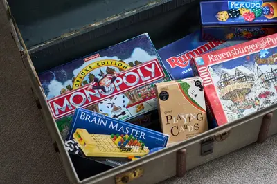 a metal box filled with lots of games and books at Tanamuir, overlooking Loch Fyne, Strachur in Cairndow