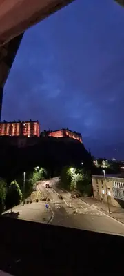 a view from a window of a city at night at Castle Terrace 1 Bed Apartment Looking onto Edinburgh Castle - Sleeps upto 4 in Edinburgh