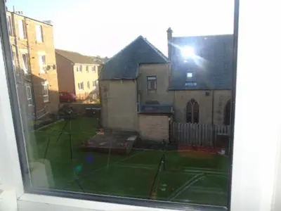 a view of a tennis court from a window at Snug - Abhainn Apartment in Helensburgh